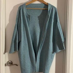 Baby blue coat with balloon sleeves.